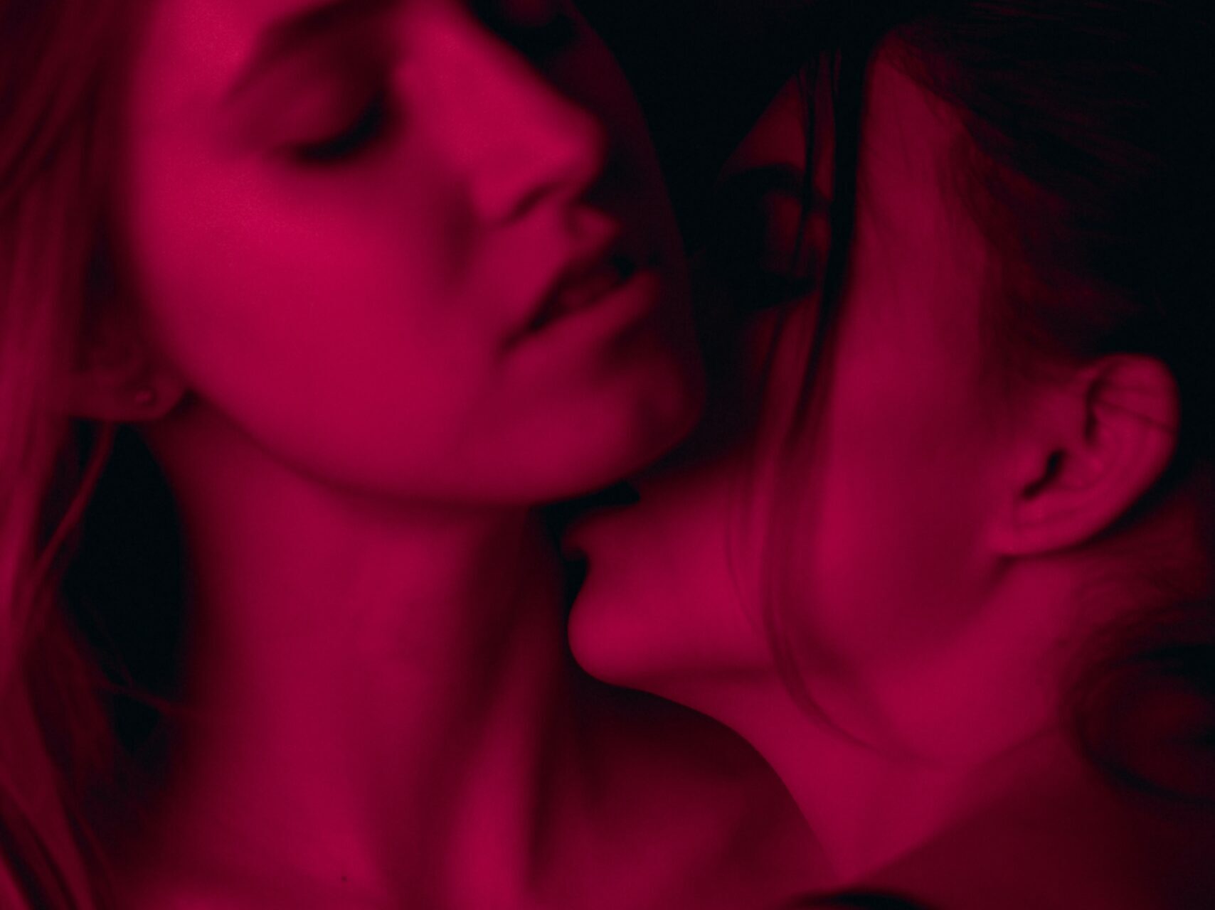 two woman wearing brassieres