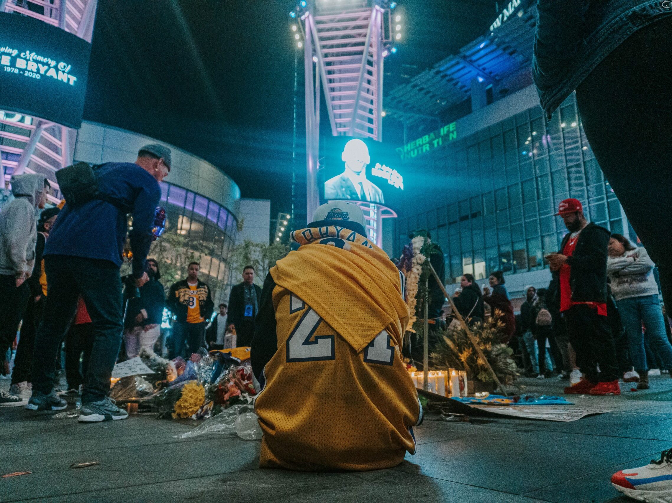 people walking on street during nighttime