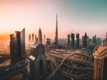 aerial photo of city highway surrounded by high-rise buildings