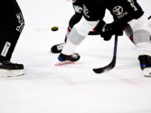 people playing ice hockey