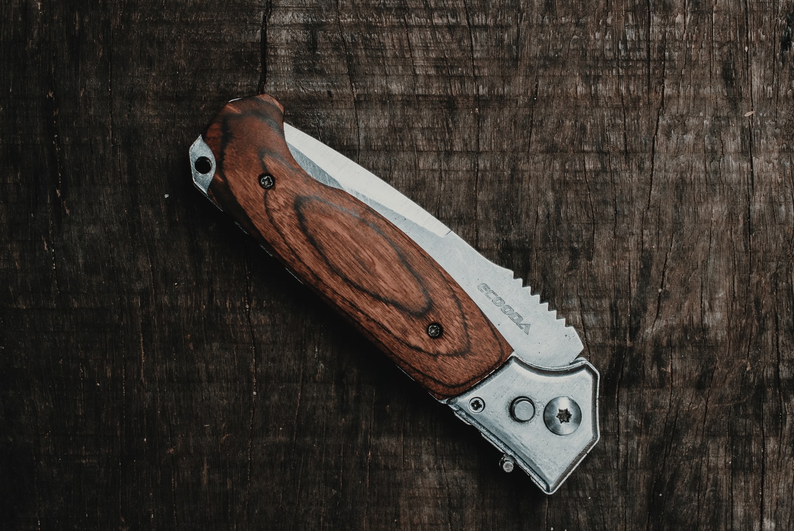 brown and silver folding knife