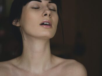 Topless Woman Closing Her Eyes