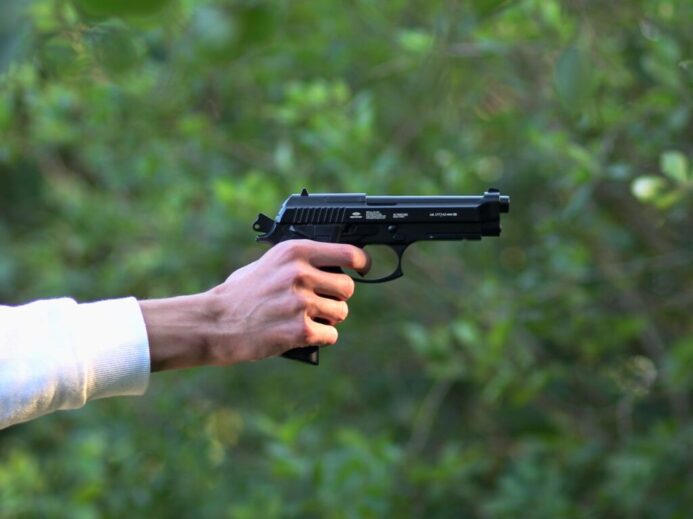 a person holding a gun