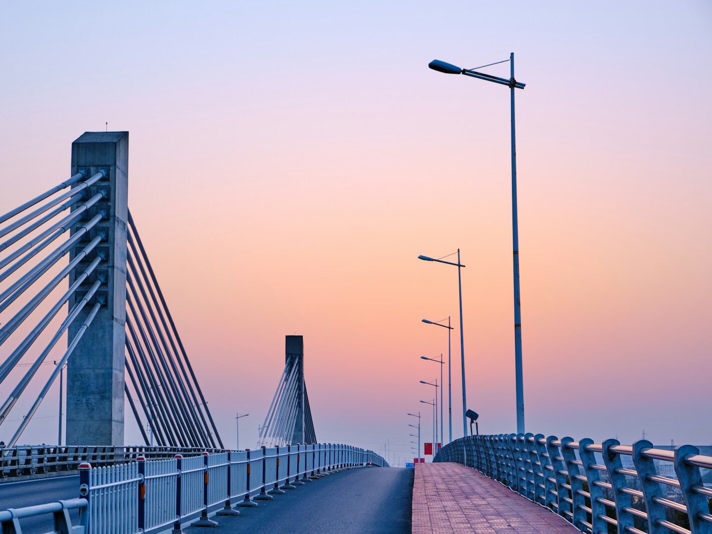gray bridge under gray sky