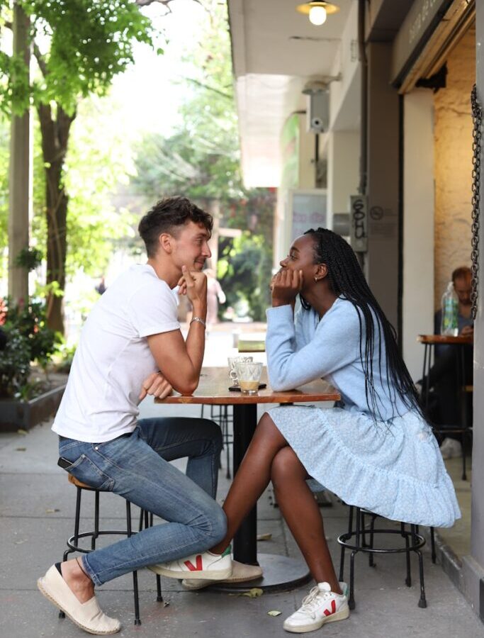 a man and a woman sitting at a table